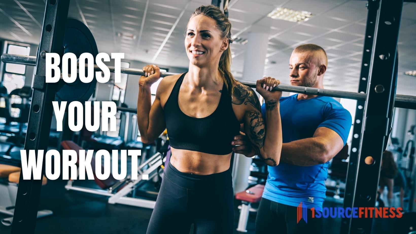 a photo of a women at the gym in a standing position holding a weight lifting bar on her sholders, a male personal trainer is correcting her form. Text that reads 'Boost your workout'